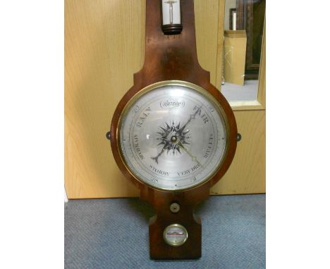 A 19th century mahogany wheel barometer by Hodgkins and Booth, Birmingham, the swanneck pediment above silvered hygrometer, b