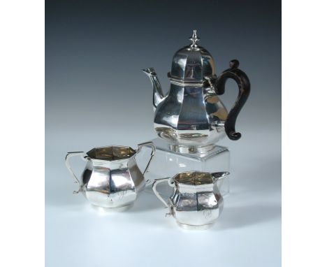 An Edwardian silver Queen Anne style three piece bachelor's teaset, by James Wakely & Frank Clarke Wheeler, London 1903, comp