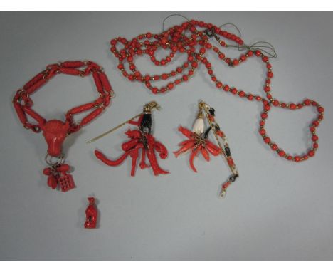 A collection of antique mainly carved coral jewellery, to include a bracelet with twin rows of spiral carved coral barrel lin