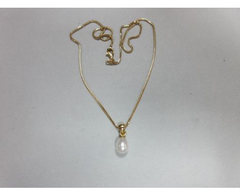 An 18ct gold chain with drop pearl pendant, the white pearl measuring 9.5 x 7.8mm on a tapered bale to an Italian fancy box l