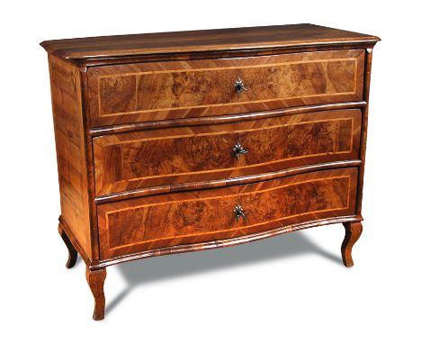 An 18th century Italian serpentine walnut commode, crossbanded and line inlaid border decoration, three long drawers, ironwor