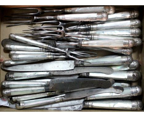 Twelve 18th century steel bladed table knives, circa 1760, the scimitar blades with composite silver and mother of pearl hand