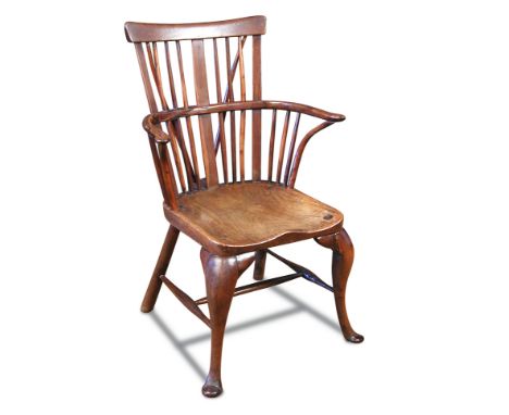 An 18th century yew wood comb back windsor chair, stamped Smith to the back of the seat 92 x 59cm (36 x 23in) 