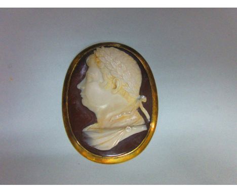 A fine hardstone cameo of a Roman emperor, the deeply carved and carefully detailed bust portrait in cream and dark brown sar