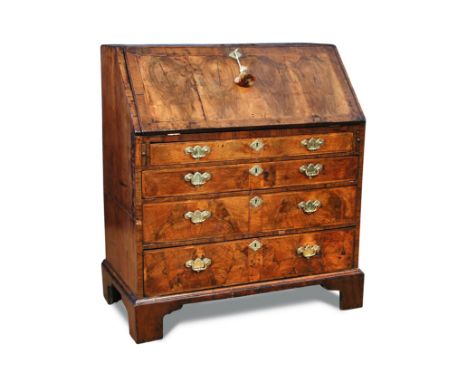 An 18th century walnut bureau, internally fitted with small drawers and pigeon holes, mirrored veneers with feather banded de