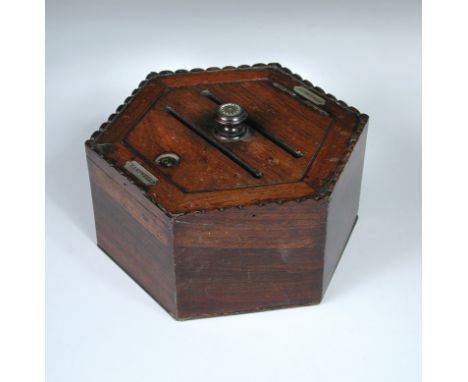 An early Victorian rosewood letter box, the hexagonal form with hinged cover and slots for answered and unanswered mail, the 