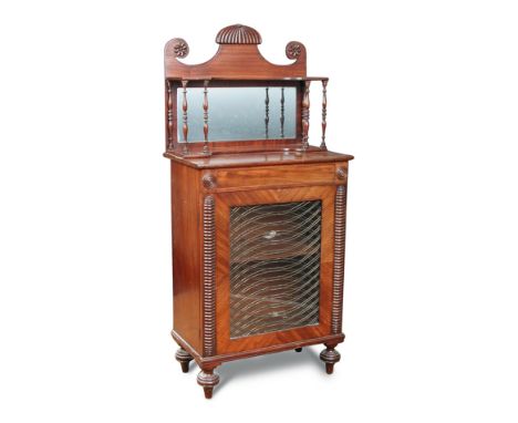 A Regency mahogany mirror back cabinet of small proportions, with raised shelf back above a glazed and wire grill door, on tu