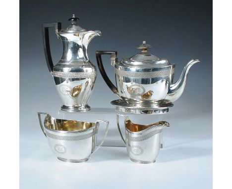 A George III silver four piece teaset, by John Emes, London 1804, comprising:- an oval teapot, the upper body engraved with a