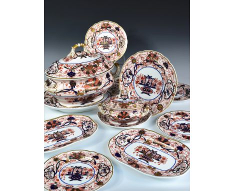 An extensive Spode Imari palette dinner service, each piece decorated with the 2283 pattern of a central vase of flowers with