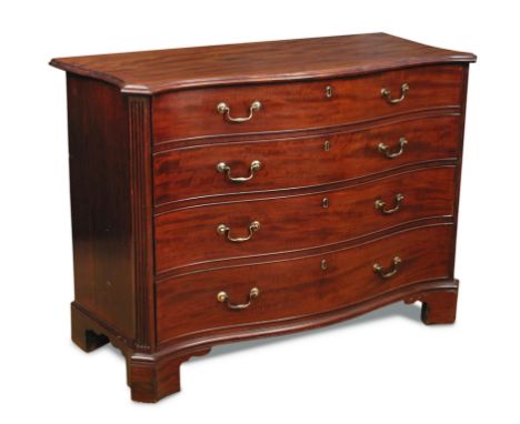 A George III serpentine mahogany commode, fitted four long drawers, brass swan neck handles, canted fluted corners, on bracke