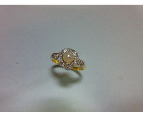 A pearl and diamond cluster ring, set with a 4.5cm pearl in a border of old variously round cut diamonds with another similar