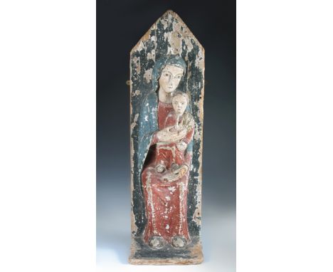 An 18th/19th century polychrome wood Madonna and Child, the Christ child makes the sign of blessing as he sits on his mother’