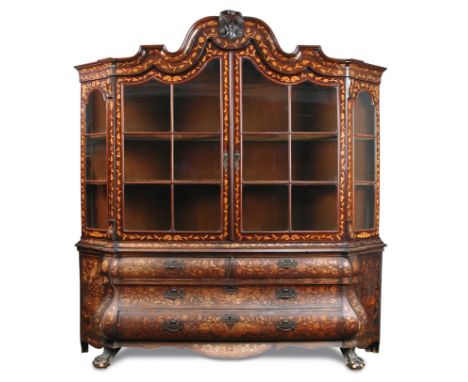 A large late 18th century Dutch walnut and marquetry inlaid vitrine, arched and moulded cornice with scroll carved cresting a