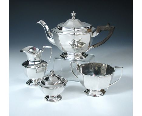 A silver four piece Teaset, by H Lambert, London 1906/07/08, comprising a small teapot of plain octagonal shape raised on a s