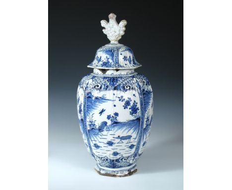 A late 17th/early 18th century Dutch Delft blue and white jar and cover, the ovoid body painted with four panels of deer belo