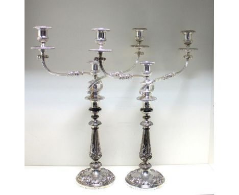 A pair of early 19th century Old Sheffield Plate candlesticks, probably by James Dixon & Sons, circa 1835, each raised from a