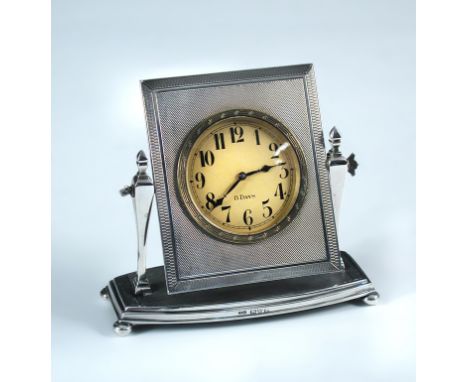 An early 20th century silver framed dressing table clock, by James Griffiths, Chester 1927, the eight day timepiece with circ