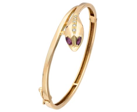 Bangle bracelet with safety clip. Set with two marquise cut natural rubies of approx. 0.26 ct. (approx. 4.8 x 2.4 mm) with in