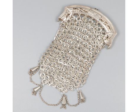Model with openwork frame set with filigree wirework and pearl rim. The bag is executed in coarse chainmail and features deco
