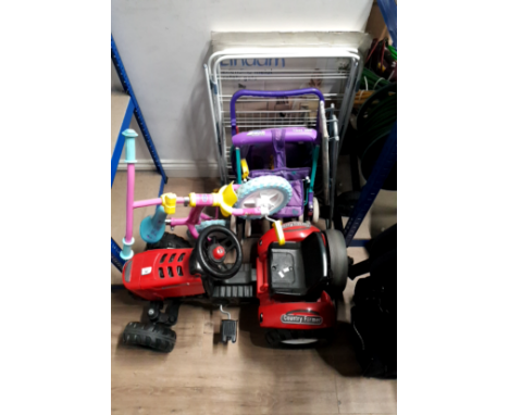 A SAFETY GATE CLOTHES AIRER TOGETHER WITH A CHILD'S BIKE AND TRACTOR