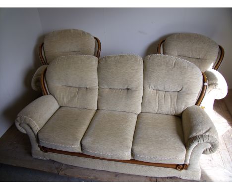 Three piece suite comprising of three seat sofa with wooden effect trim, matching armchair and electric reclining armchair 