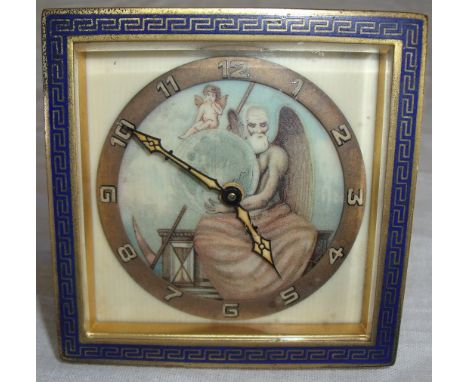 Early 20th C gilt metal clock with enamel Greek key frame and painted ivory dial with 8 day wind up movement and easel stand 