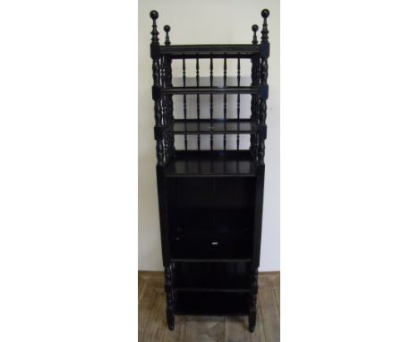 Edwardian ebonised seven tier open shelf stand with turned supports and panelled detail to the sides (height 145cm)