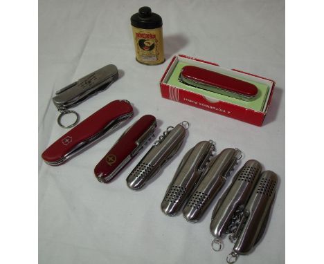 Small tin of Wilson's CO.RE.GA Dental Plate powder, selection of Swiss Army knives etc.