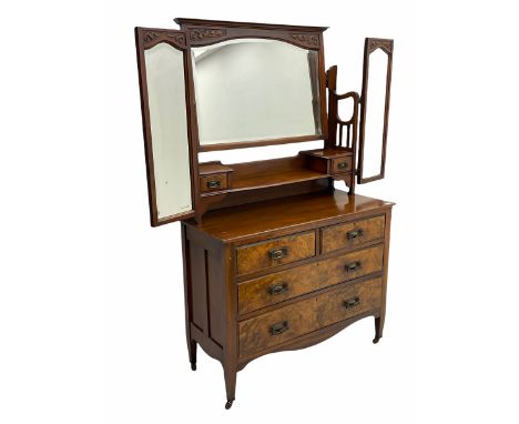 Late Victorian walnut triple mirror back dressing chest, two trinket drawers above two short an two long drawers, shaped apro