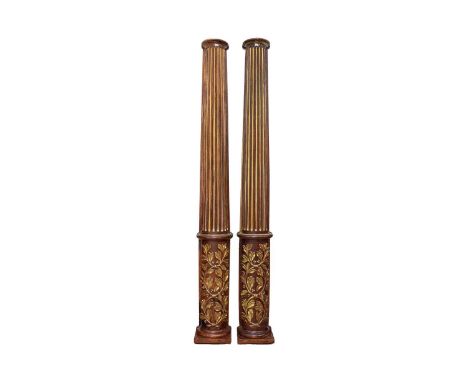 A pair of large and impressive architectural mahogany effect carved wood and parcel gilt (engaged) classical half columns wit