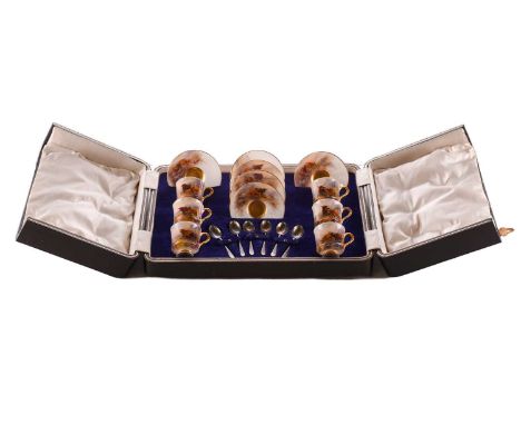 A presentation cased Harry Stinton for Royal Worcester porcelain demitasse coffee set for six persons, painted with highland 