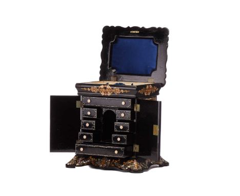 A Victorian papier mache table writing cabinet, work box in the manner of Jennens & Bettridge of Birmingham, with a moulded t
