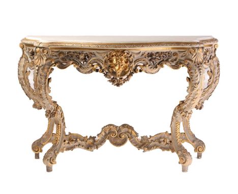 An 18th-century style Venetian carved, painted and parcel gilt serpentine console table, 20th century, With white marble top 