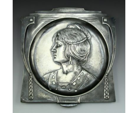 A WMF Art Nouveau pewter plate, Germany, c. 1900. Embossed with a portrait of a woman. Dimensions: 22X21 cm. Minor flaws (scr