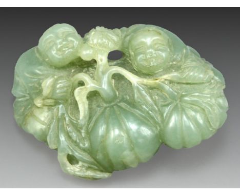 A fine Chinese green jade figurine, shaped as two children with pumpkins. Length: 6 cm.