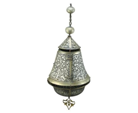 An Islamic hanging oil lamp, inlaid with silver (Damascene) and decorated with figures of animals and plants. Height: approx.