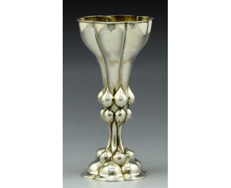 A Swiss 800 silver goblet by U. Sauter, Basel, late 19th century. Designed in Baroque style with scale motifs and gilt interi