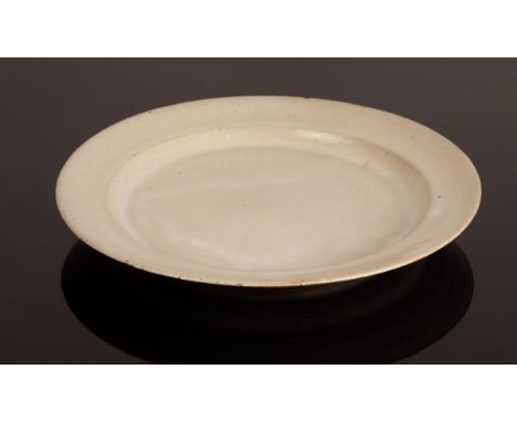 Rupert Spira (born 1960), stoneware plate, cream speckled glaze, impressed seal mark, 19.75cm diameter CONDITION REPORT: Few 