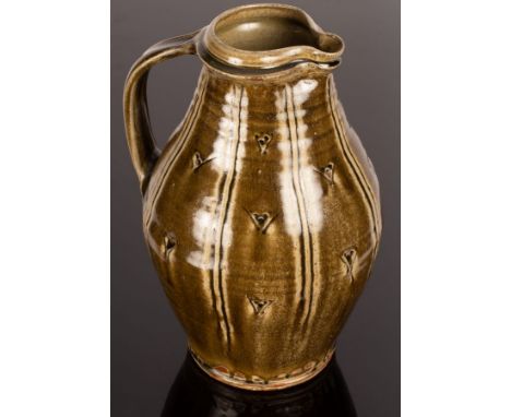 Mike Dodd (born 1943), tall stoneware jug, green ash glaze with incised line decoration, impressed mark, 34cm high CONDITION 