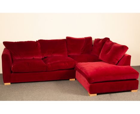 A large L shaped 'Wadenhoe' sofa, upholstered in red velvet CONDITION REPORT: No fire safety labels although cushions are dow