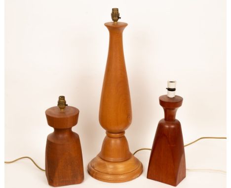 Peter Evans (died 2007), three turned wood table lamps, the largest 69cm high, all with Peter & Joy Evans stickers to base/No