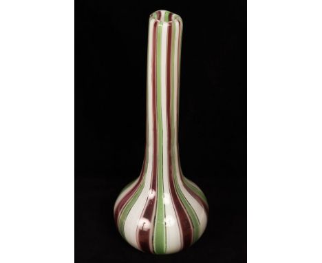 A Murano striped glass bottle, 40cm high and a clear and ruby glass bowl with ribbed sides, 17cm wide, both unmarked  CONDITI