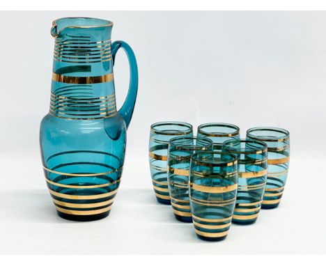 Bohemian Glass. A Mid Century gilt and turquoise glass drinks set. Made in Czechoslovakia. 1950/1960. Pitcher 27cm. 11cm