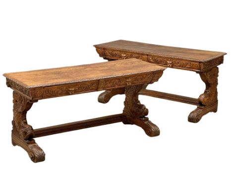 A pair of large 19th Century Victorian carved oak console tables, with man of the forest drawers, koi fish style supports on 
