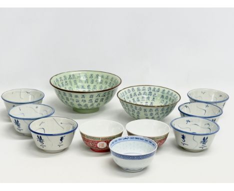 A collection of Chinese bowls. 2 vintage celadon glazed longevity bowls with Kangxi 6 character marks. 6 matching rice bowls 