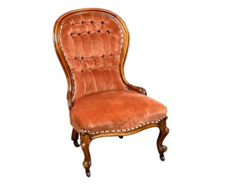 A 19th Century Victorian mahogany deep button, spoon back bedroom chair/ladies chair on cabriole legs. Circa 1860.