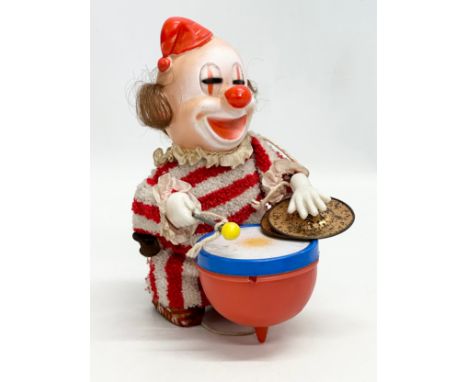A vintage Japanese windup drummer clown. 18cm