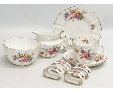 A quantity of Royal Crown Derby “Posies” . Including tea cup, saucers and sandwich plate, 4 napkin rings, milk jug and sugar 