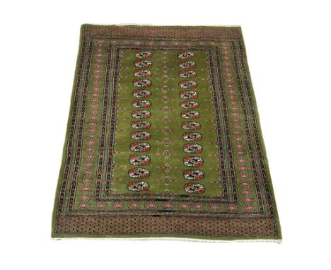 A vintage Middle Eastern hand knotted rug. 127x182cm