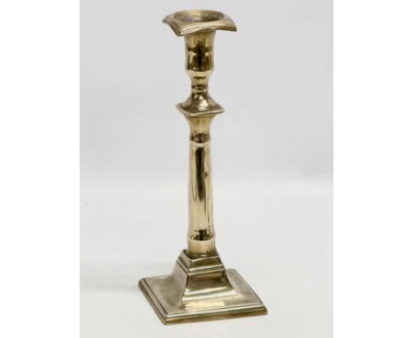 An Early 18th Century George I brass candlestick. Circa 1714-1727. 27cm